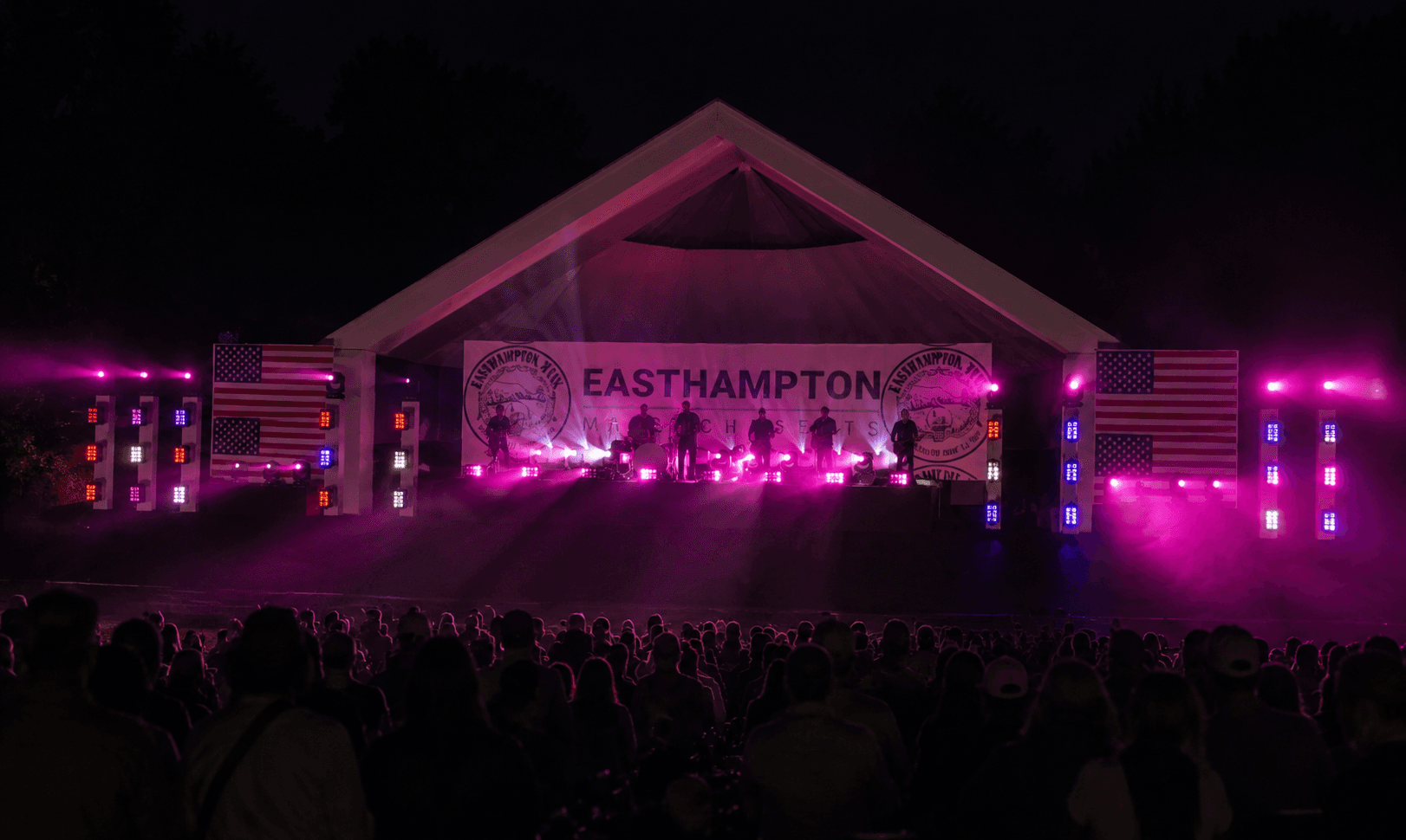 America's 250th finale at Mill Side Park — flag-lit stage, laser show, and a packed crowd at night