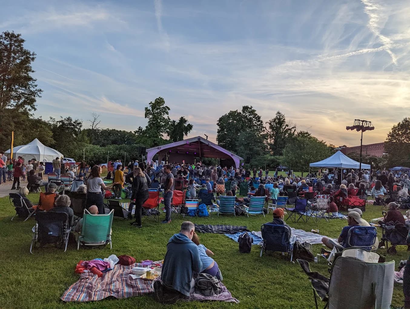 Mill Side Park at dusk with crowd